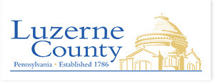 Logo of Luzerne County, Pennsylvania, featuring the county name, establishment year (1786), and an illustration of a building.