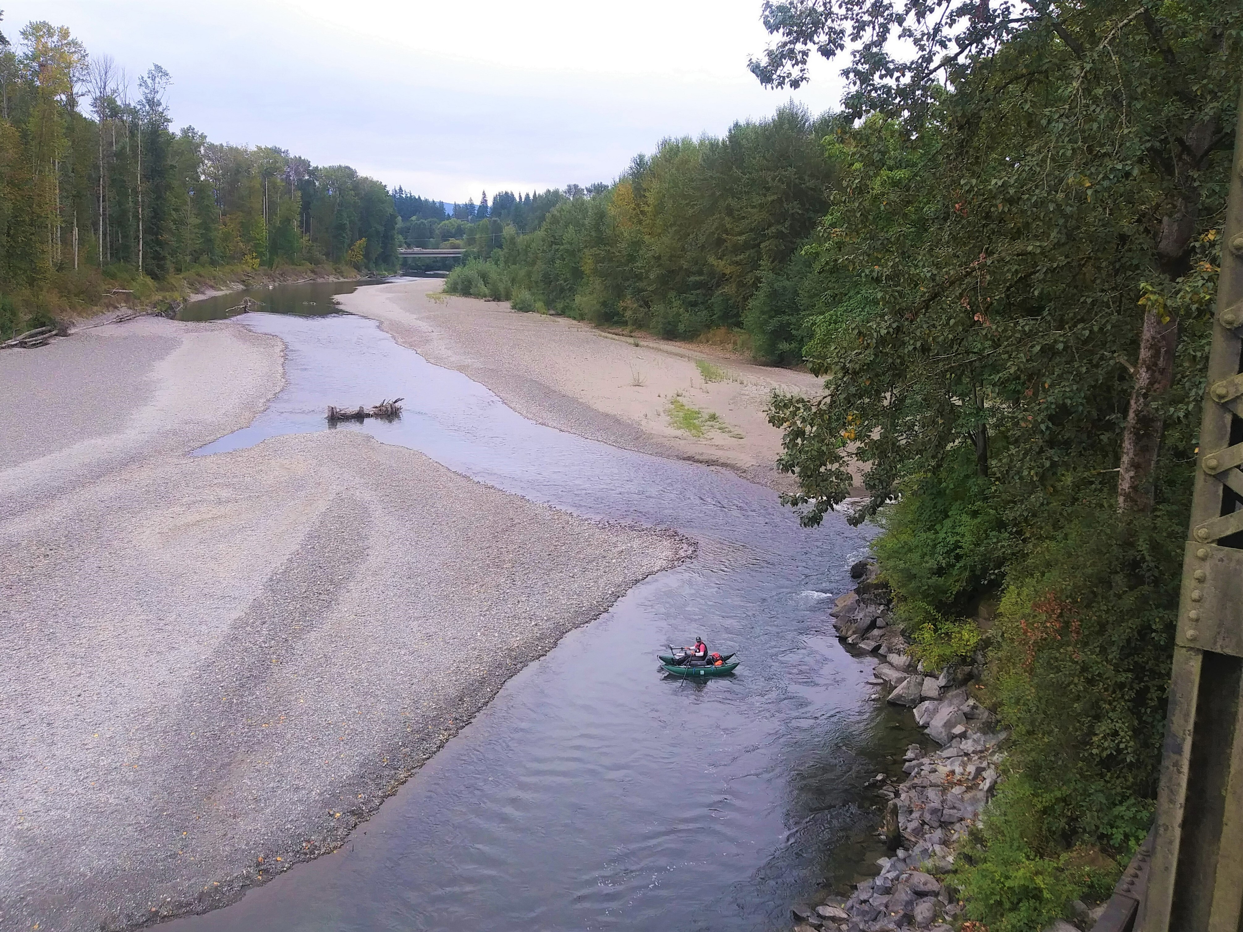 View of WDFW staff in a raft in a river as seen from above.